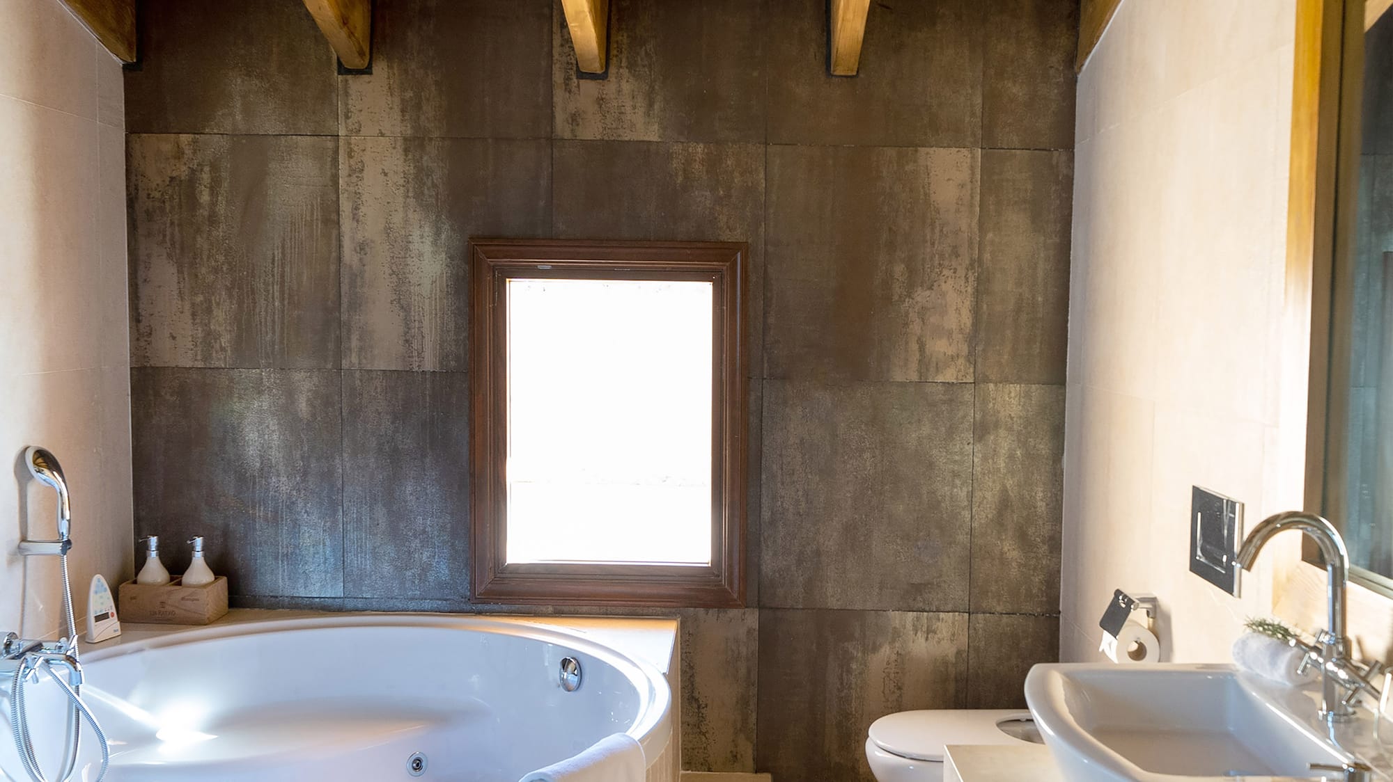 a bathroom with a tub and sink