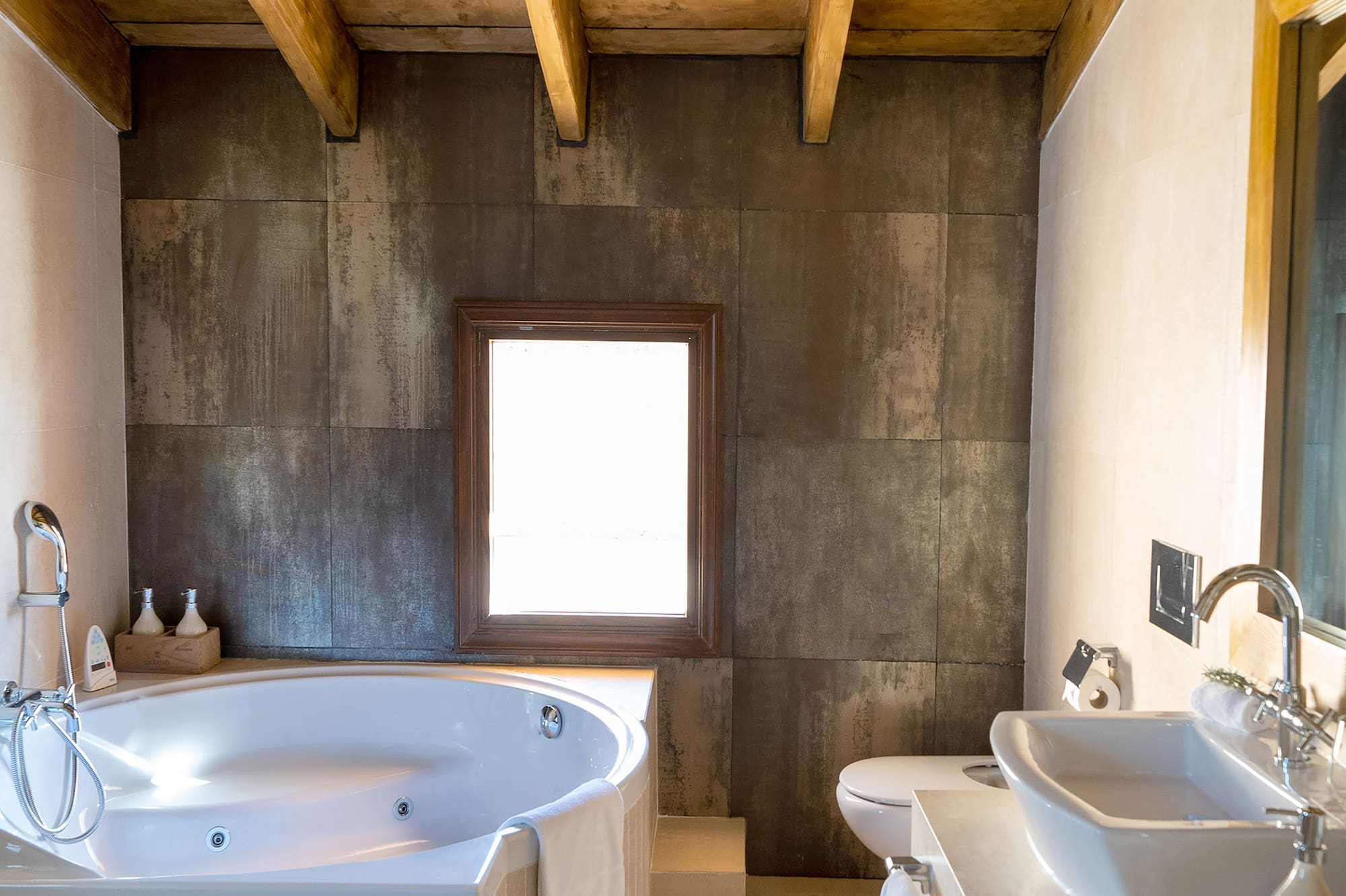 a bathroom with a tub and sink