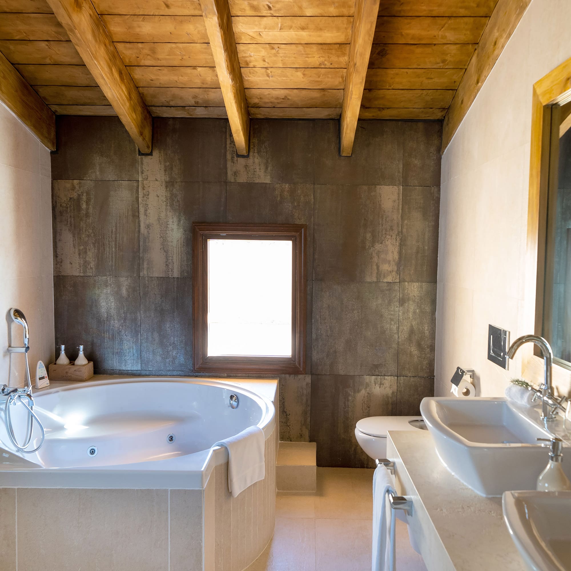 a bathroom with a tub and sink