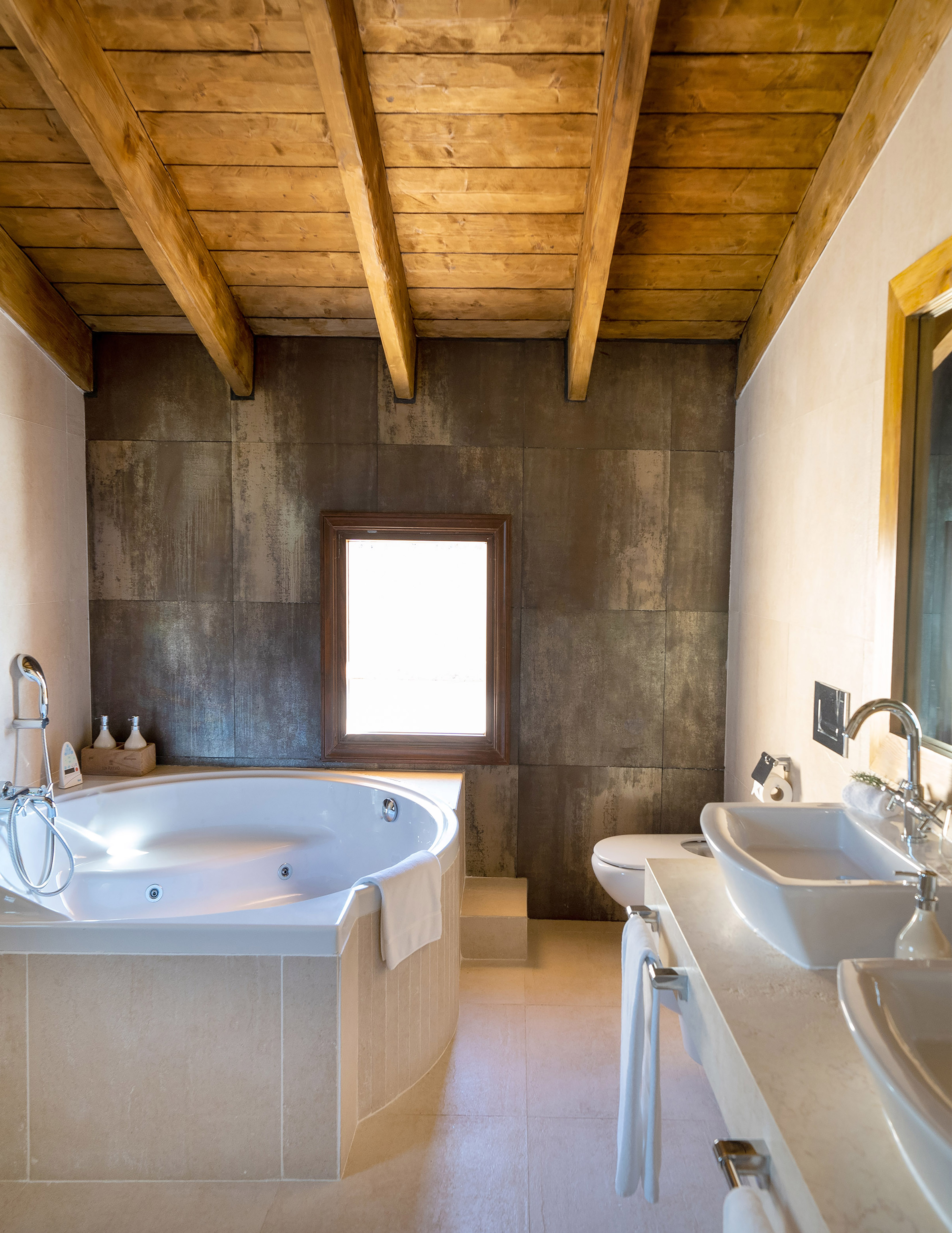 a bathroom with a tub and sink