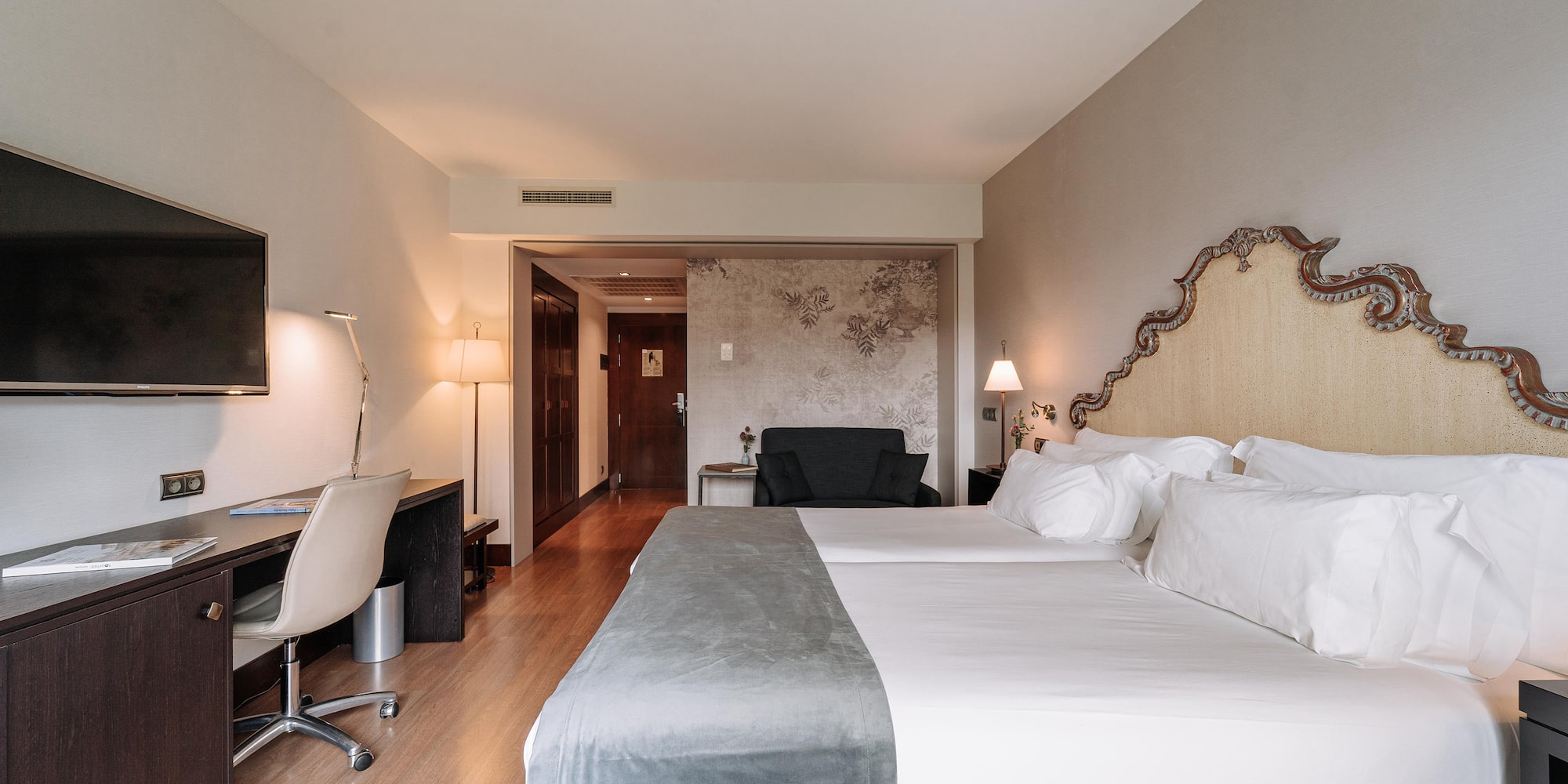 a room with a bed and a desk