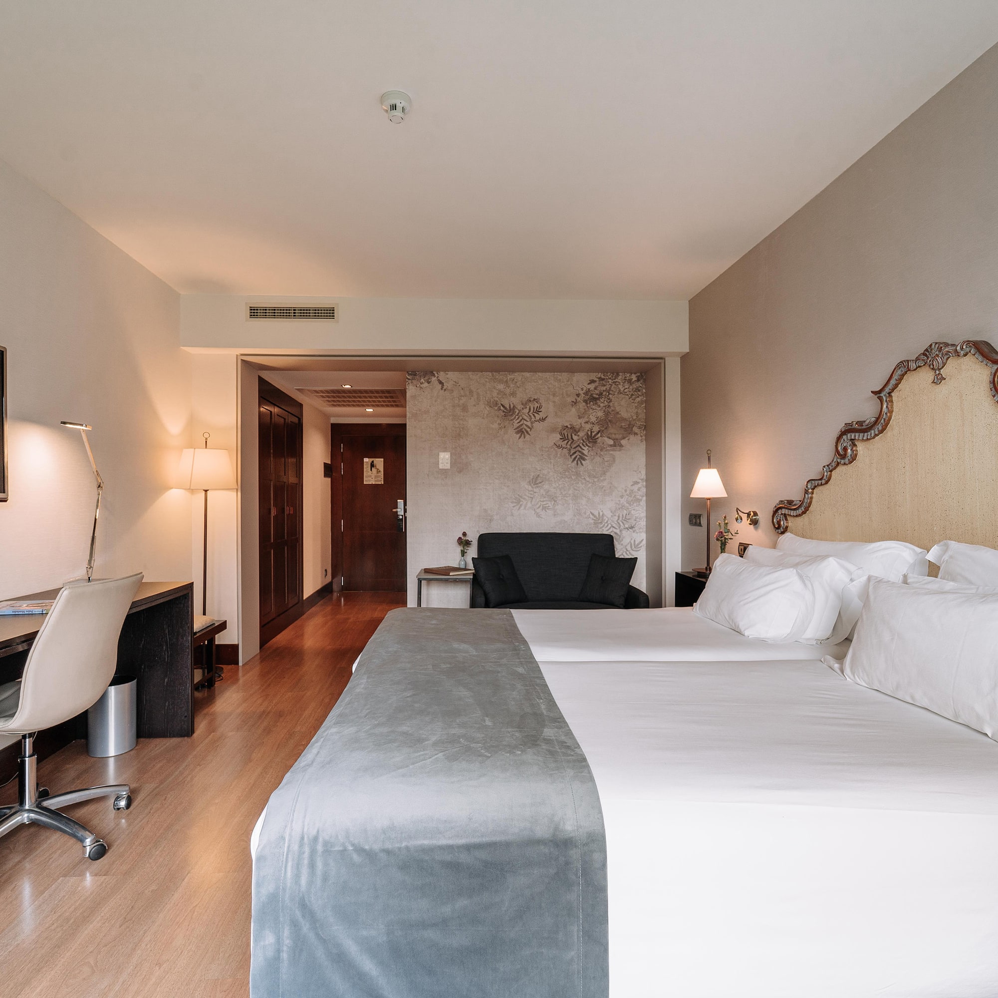 a room with a bed and a desk