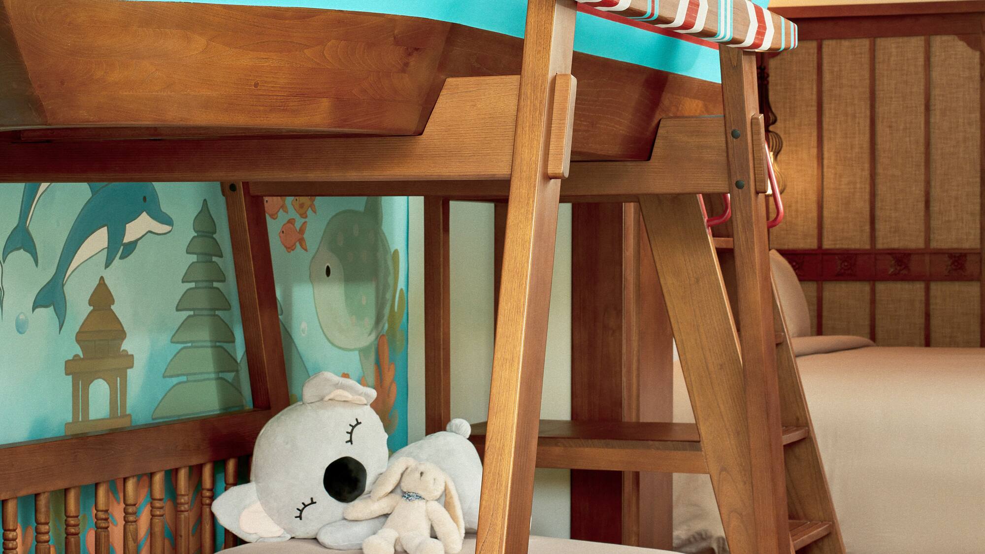 a bunk bed with a stuffed animal