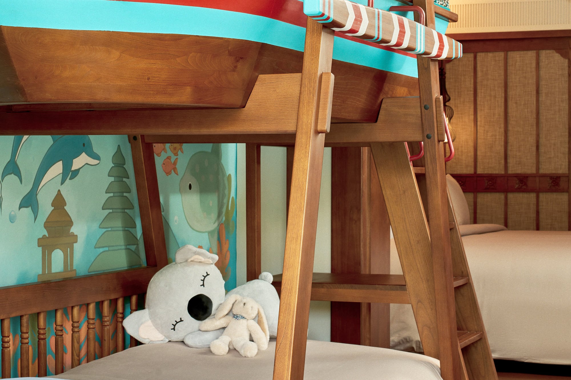a bunk bed with a stuffed animal