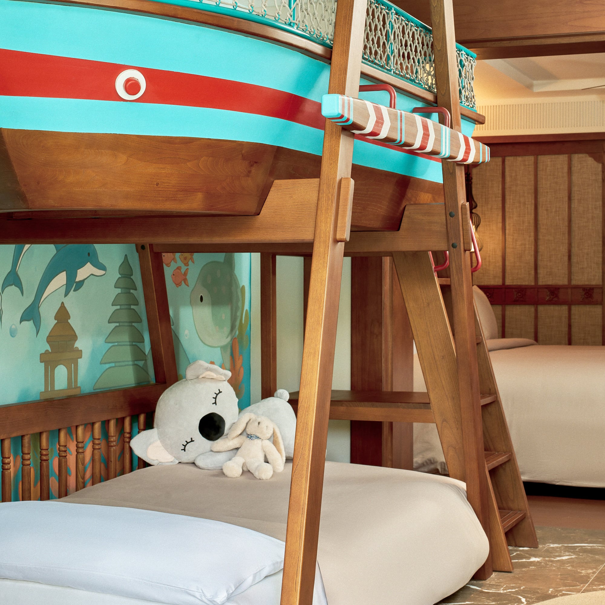 a bunk bed with a stuffed animal