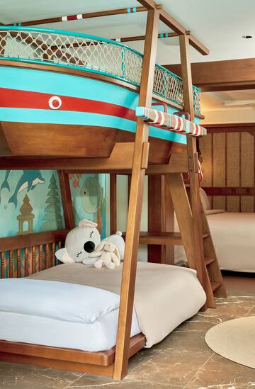 a bunk bed with a stuffed animal