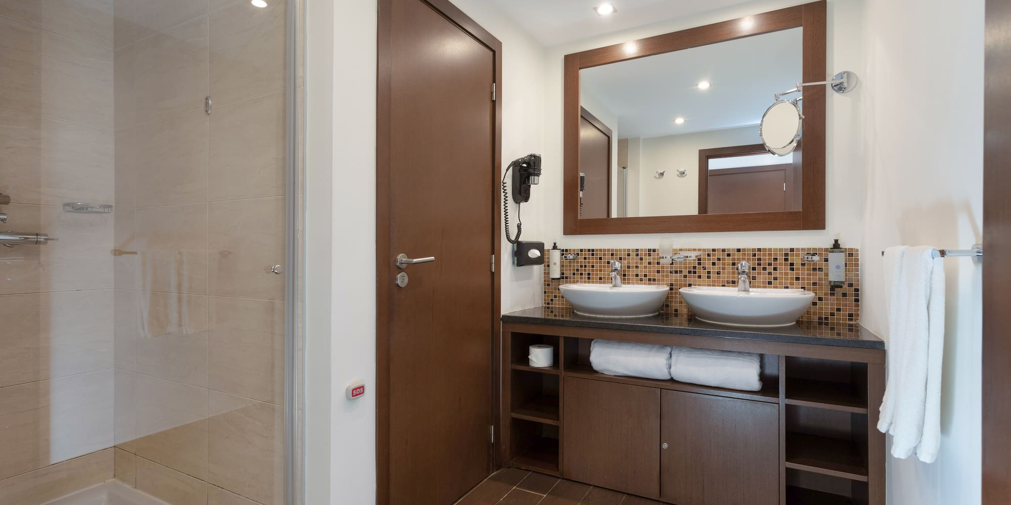 a bathroom with a mirror and sink