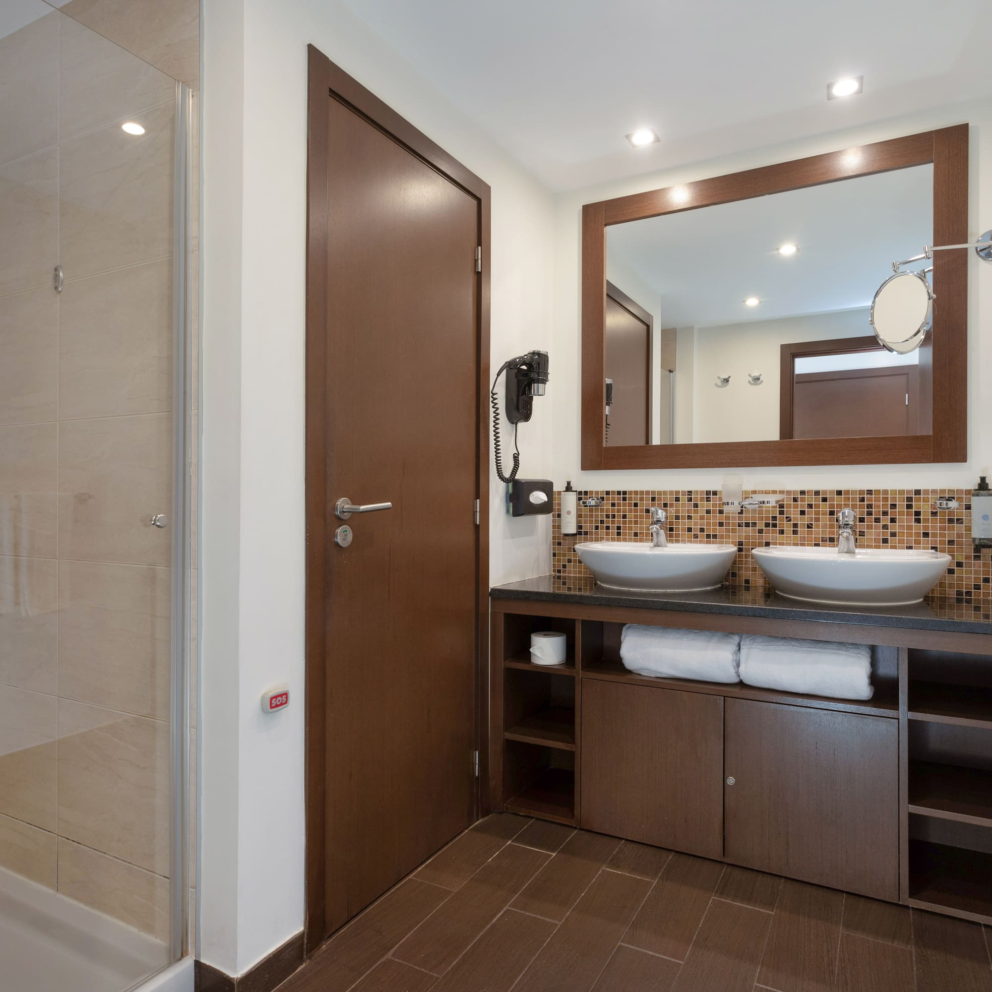 a bathroom with a mirror and sink