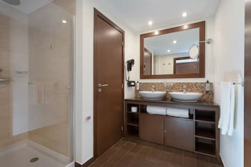 a bathroom with a mirror and sink