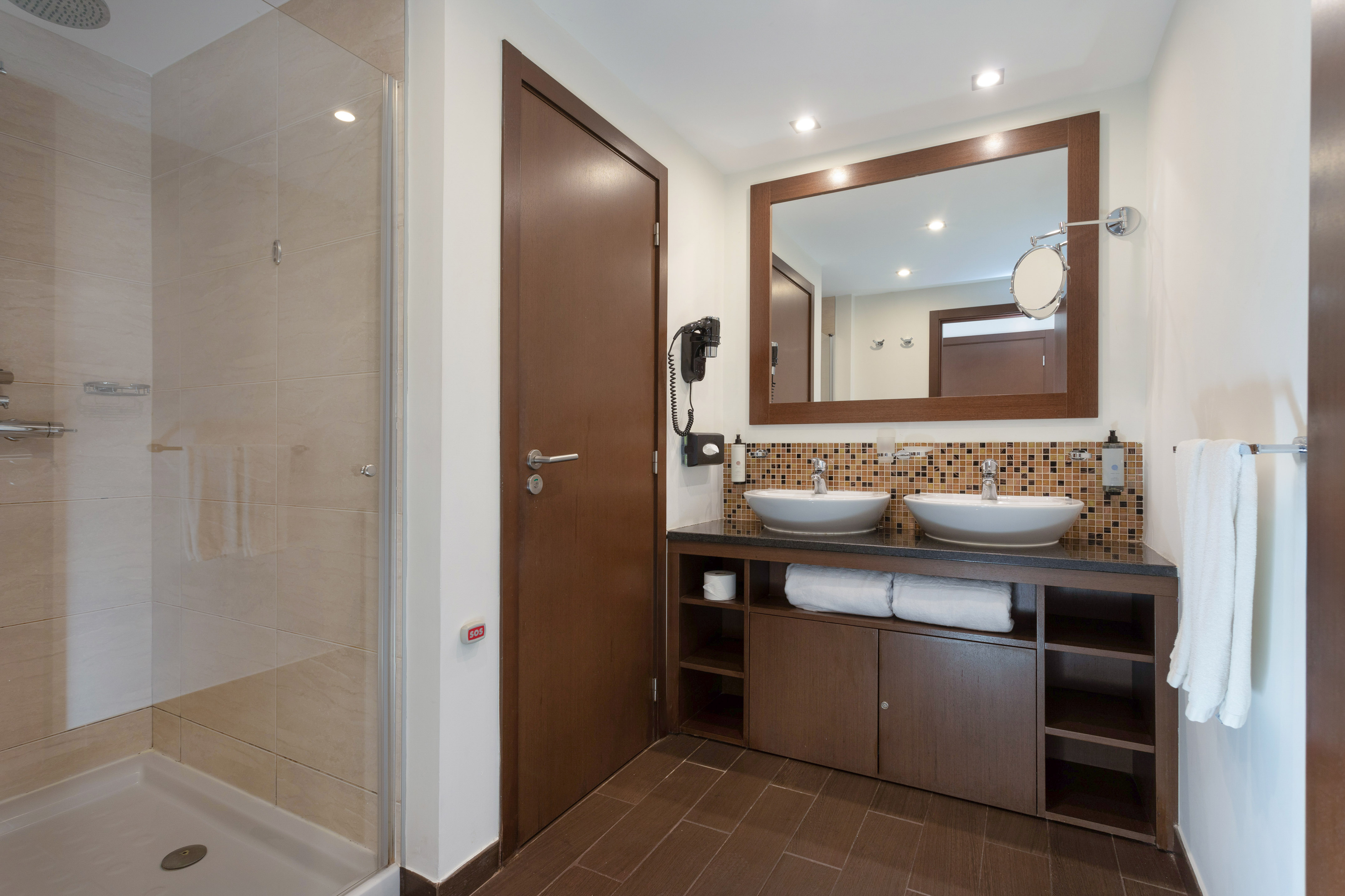 a bathroom with a mirror and sink