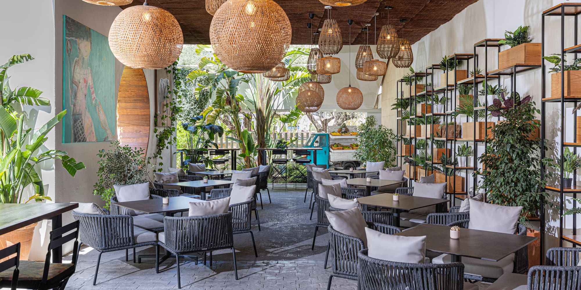 a room with tables and chairs and lights