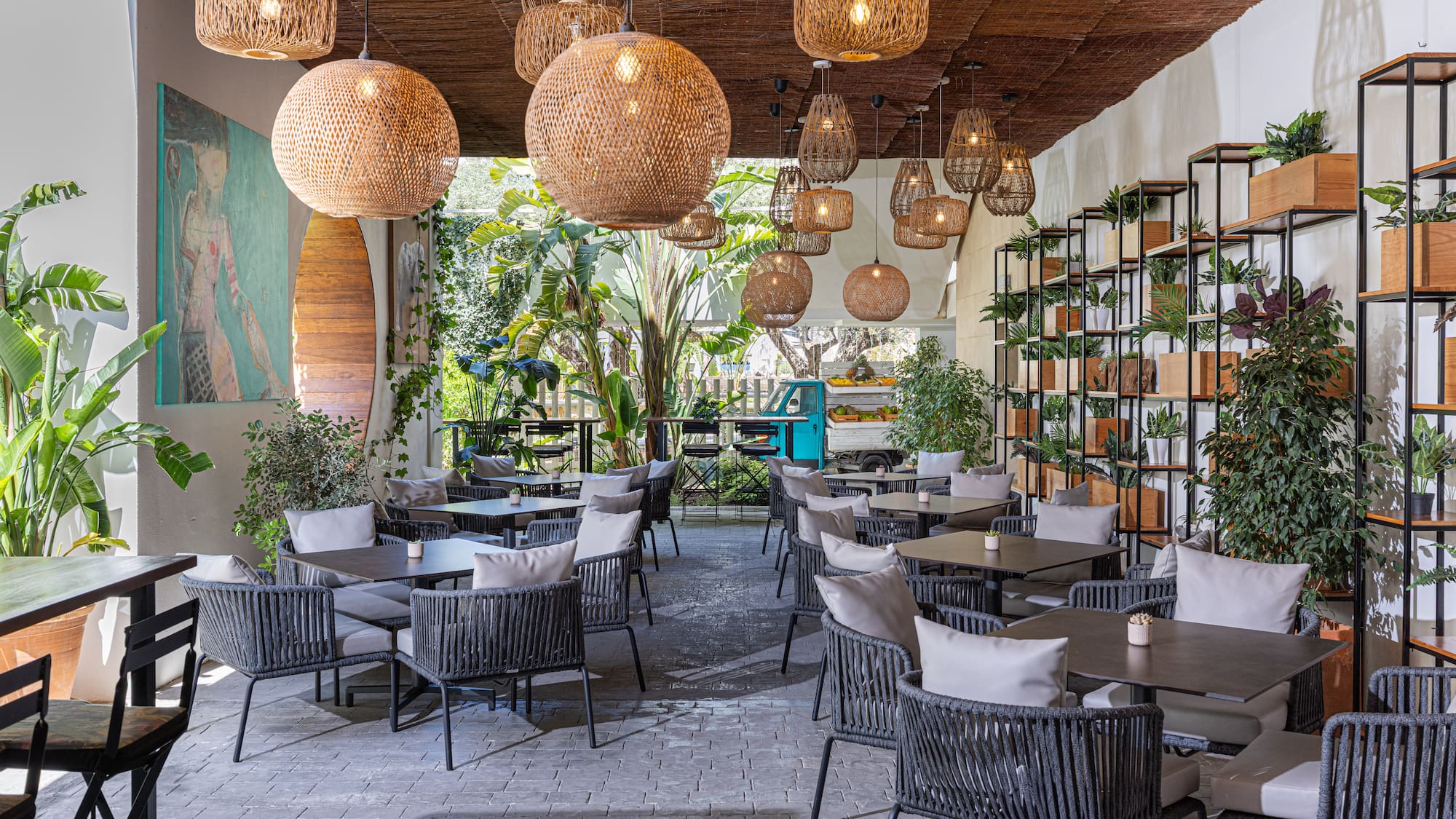 a room with tables and chairs and lights