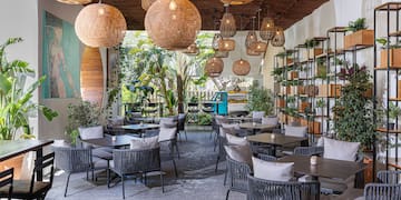 a room with tables and chairs and lights