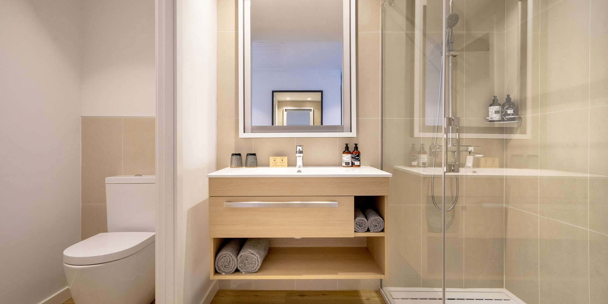 a bathroom with a mirror and a toilet