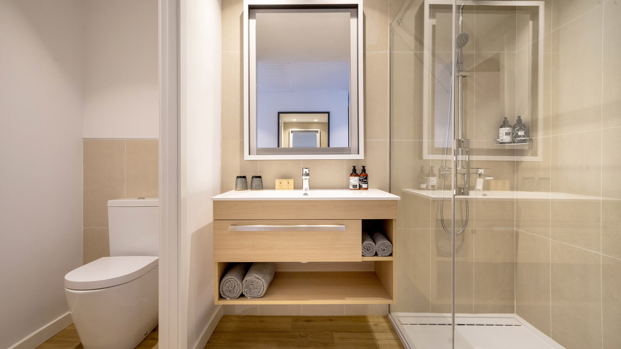 a bathroom with a mirror and a toilet