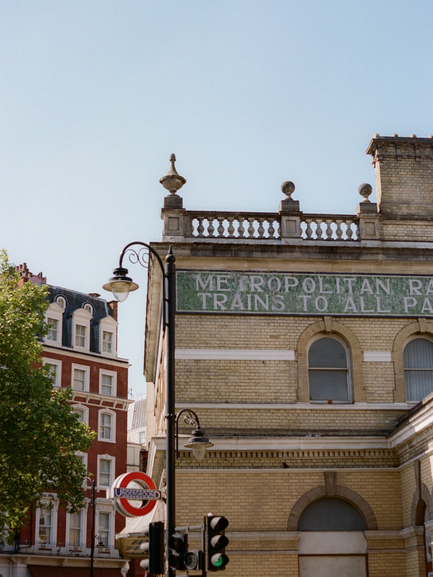 London's historic Metropolitan Railway building exterior and Underground sign.