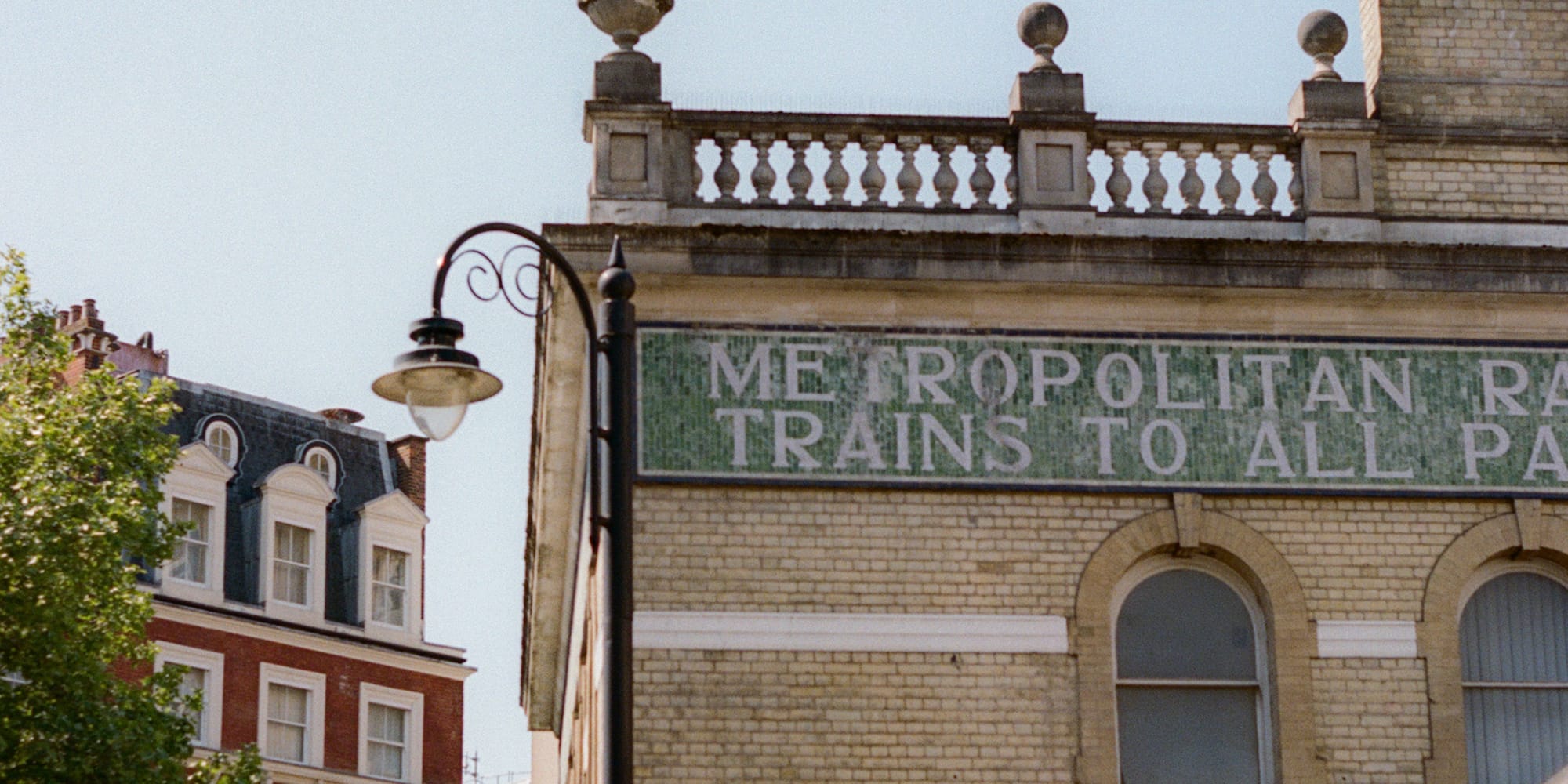 Metropolitan Railway station, London Underground sign, historic streetscape.