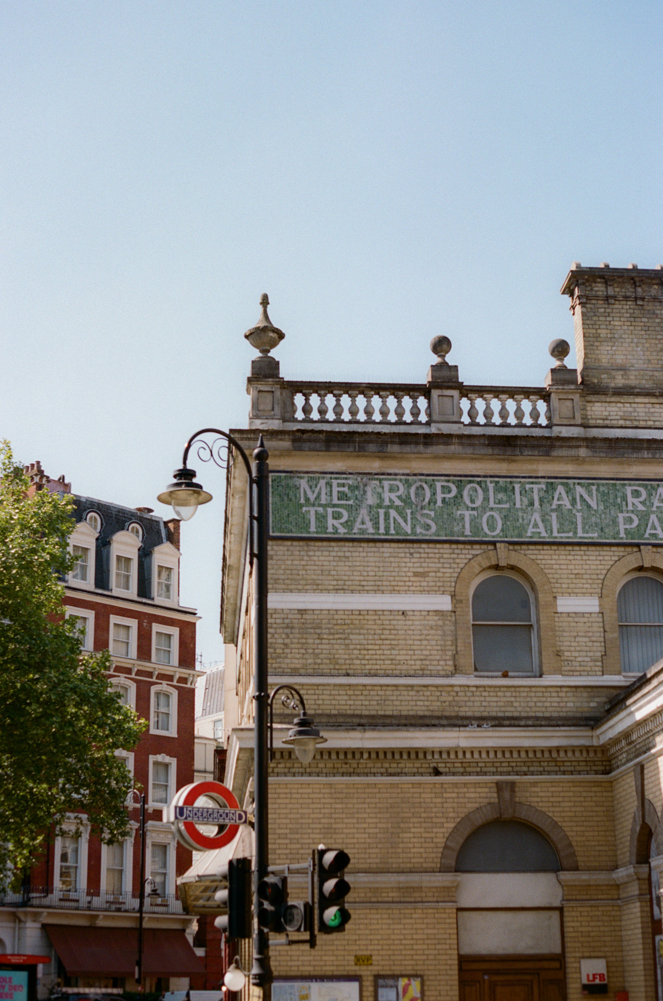 London's historic Metropolitan Railway building exterior and Underground sign.