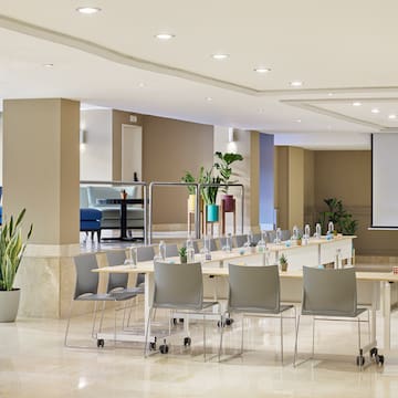 a room with a large table and chairs