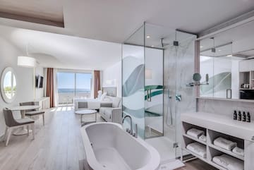 a bathroom with a tub and a shower