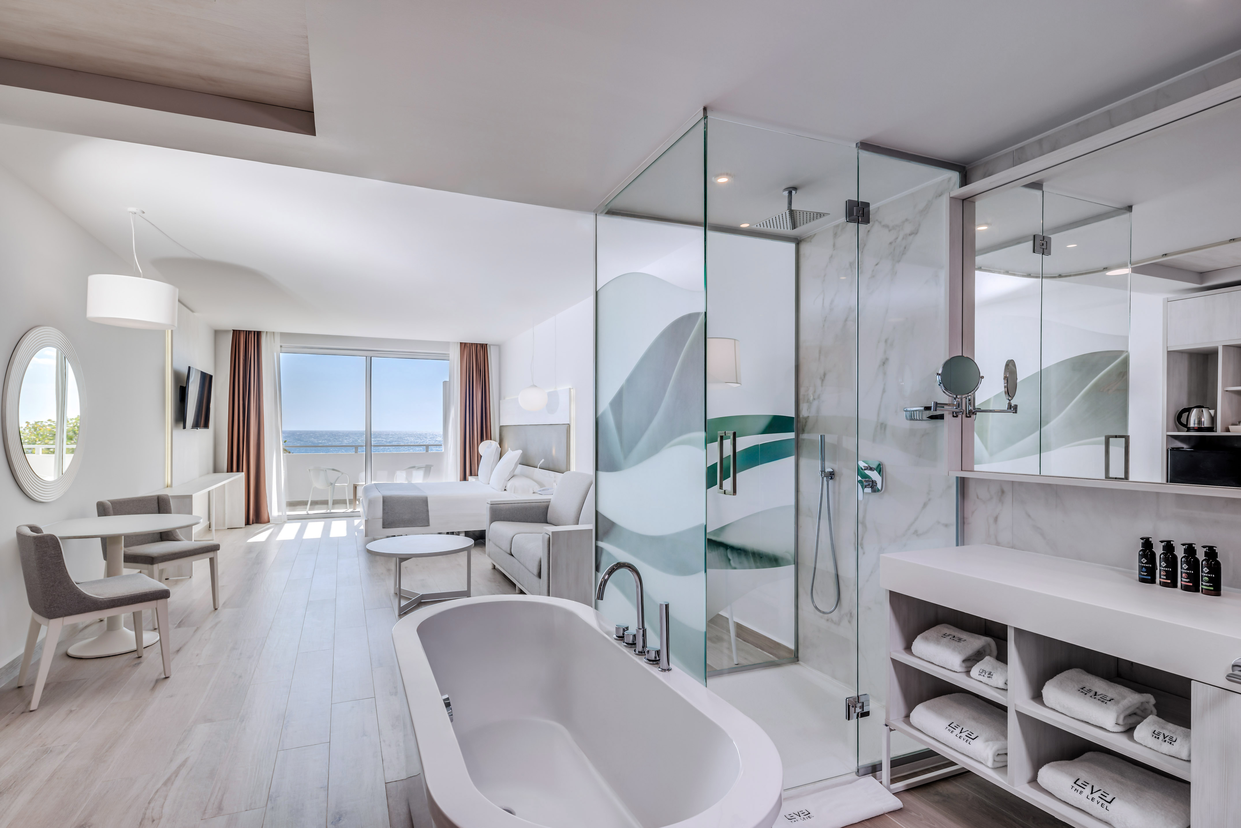 a bathroom with a tub and a shower