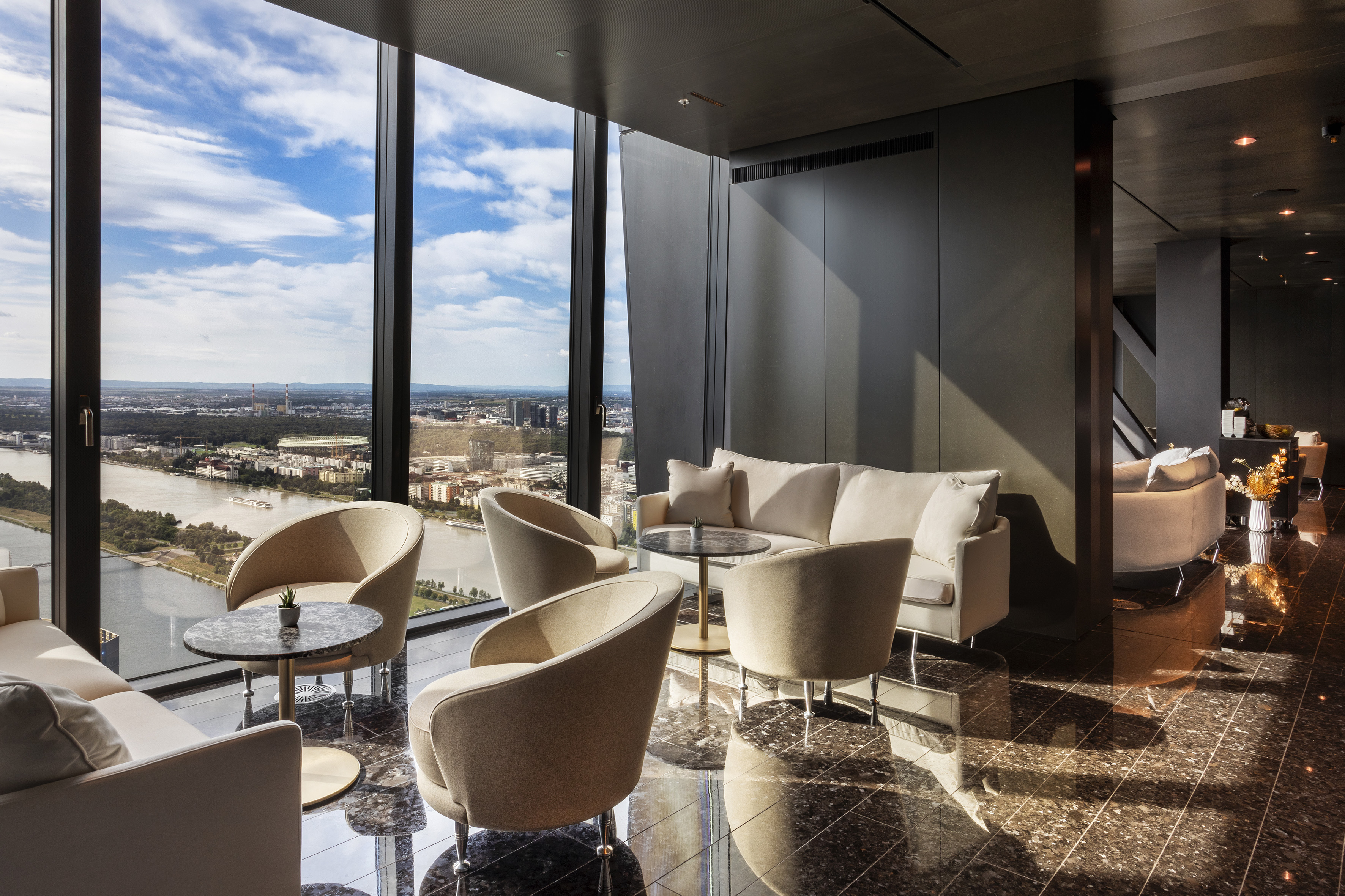 a room with a view of a city and a window