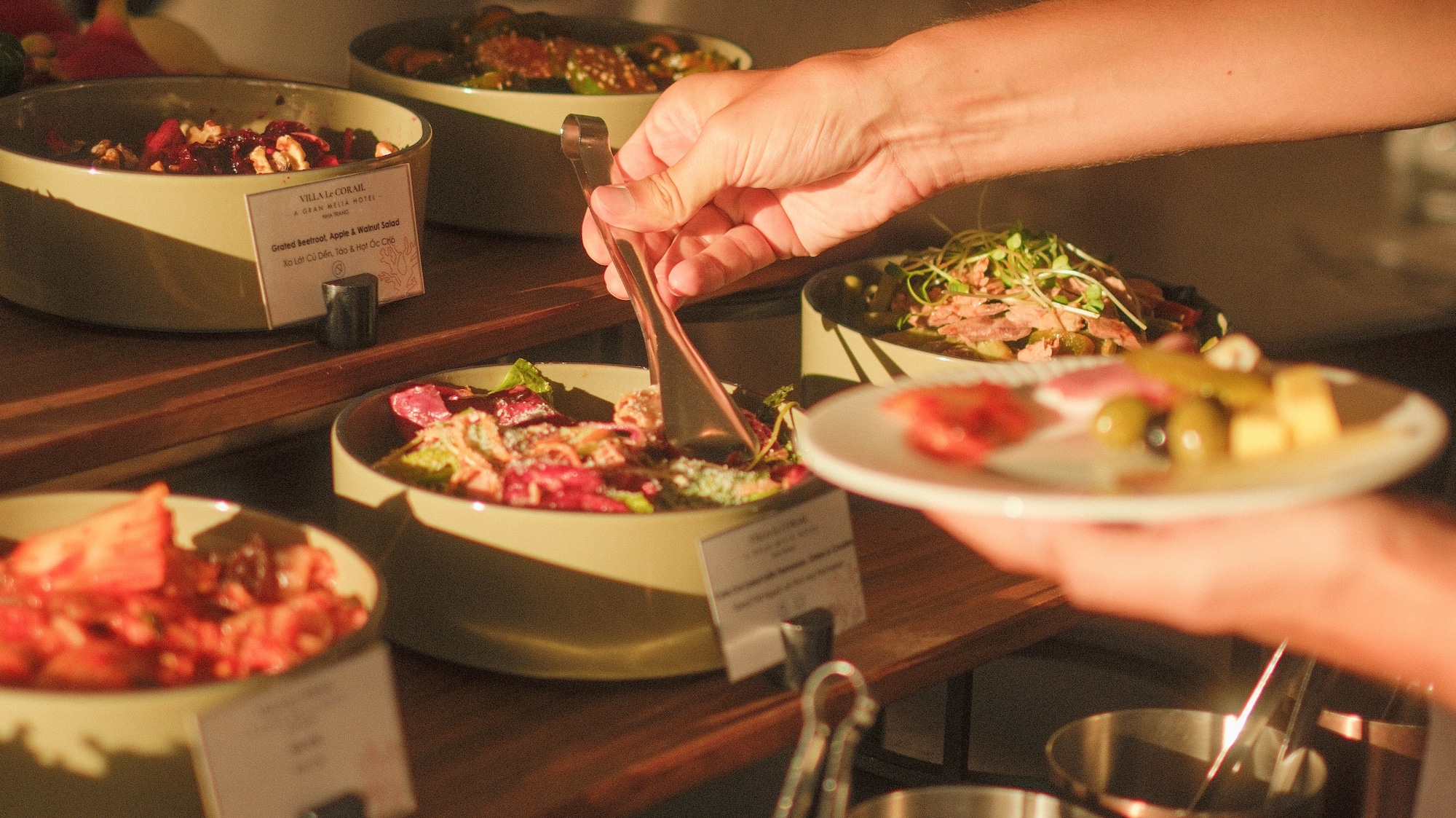 a person holding a plate of food