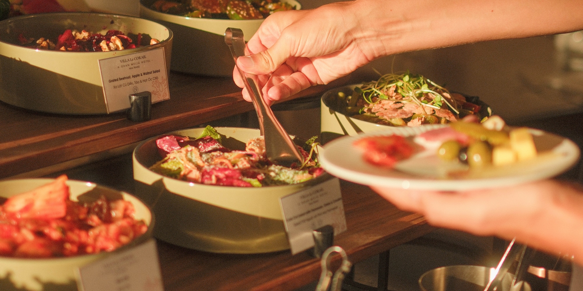 a person holding a plate of food