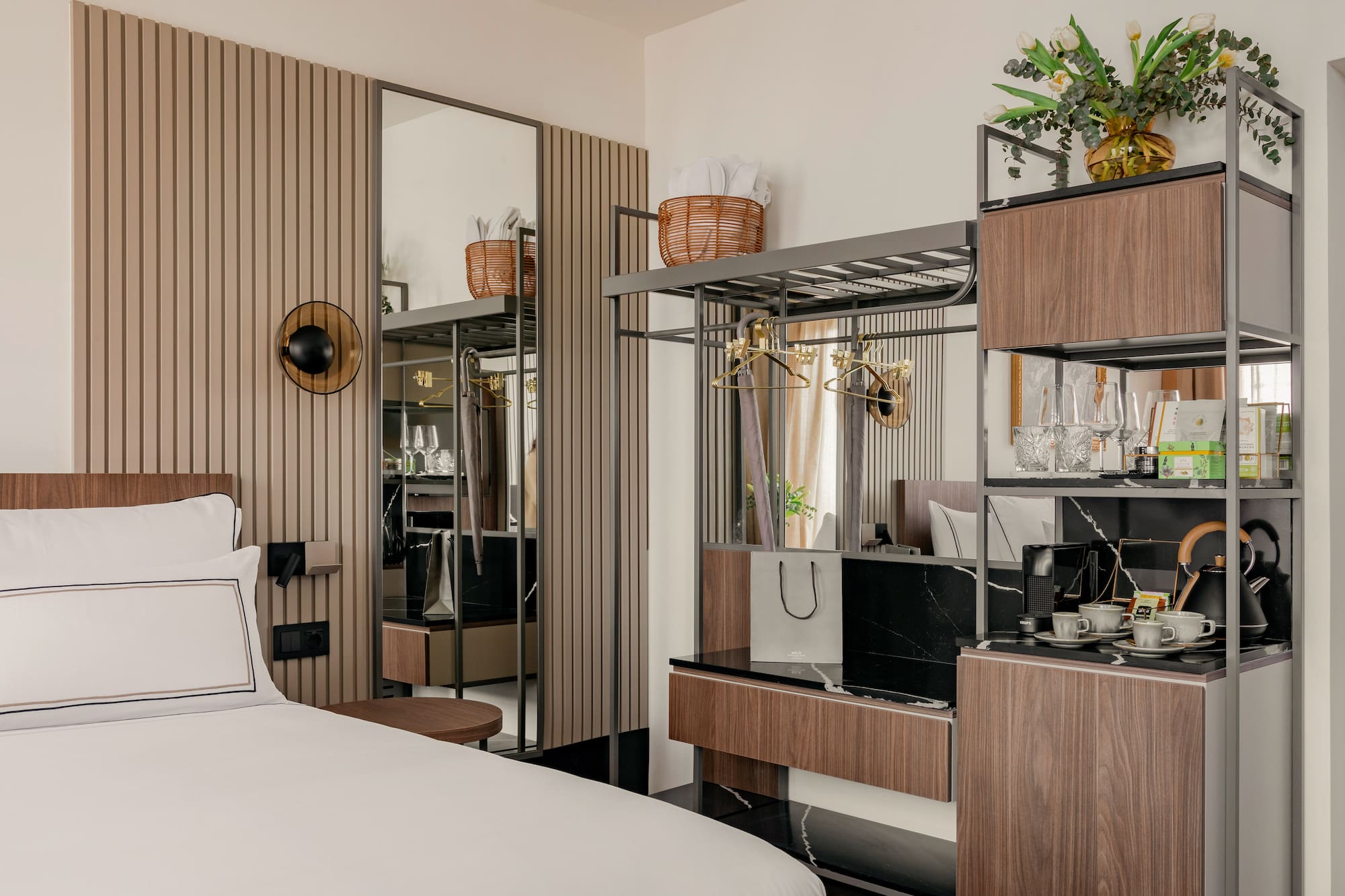 a room with a bed and a mirror