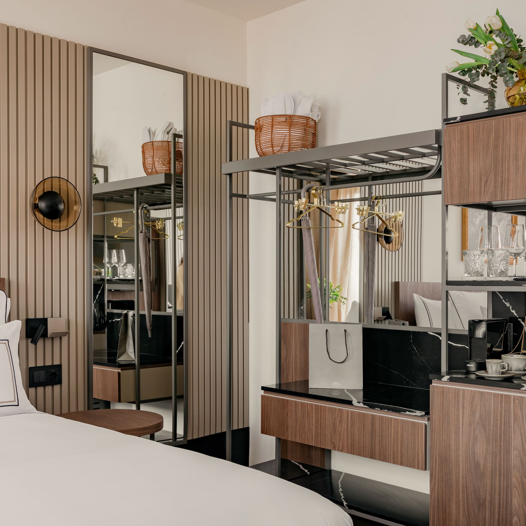 a room with a bed and a mirror