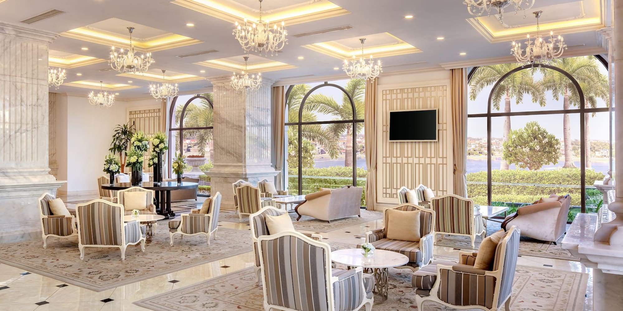 a room with chandeliers and chairs