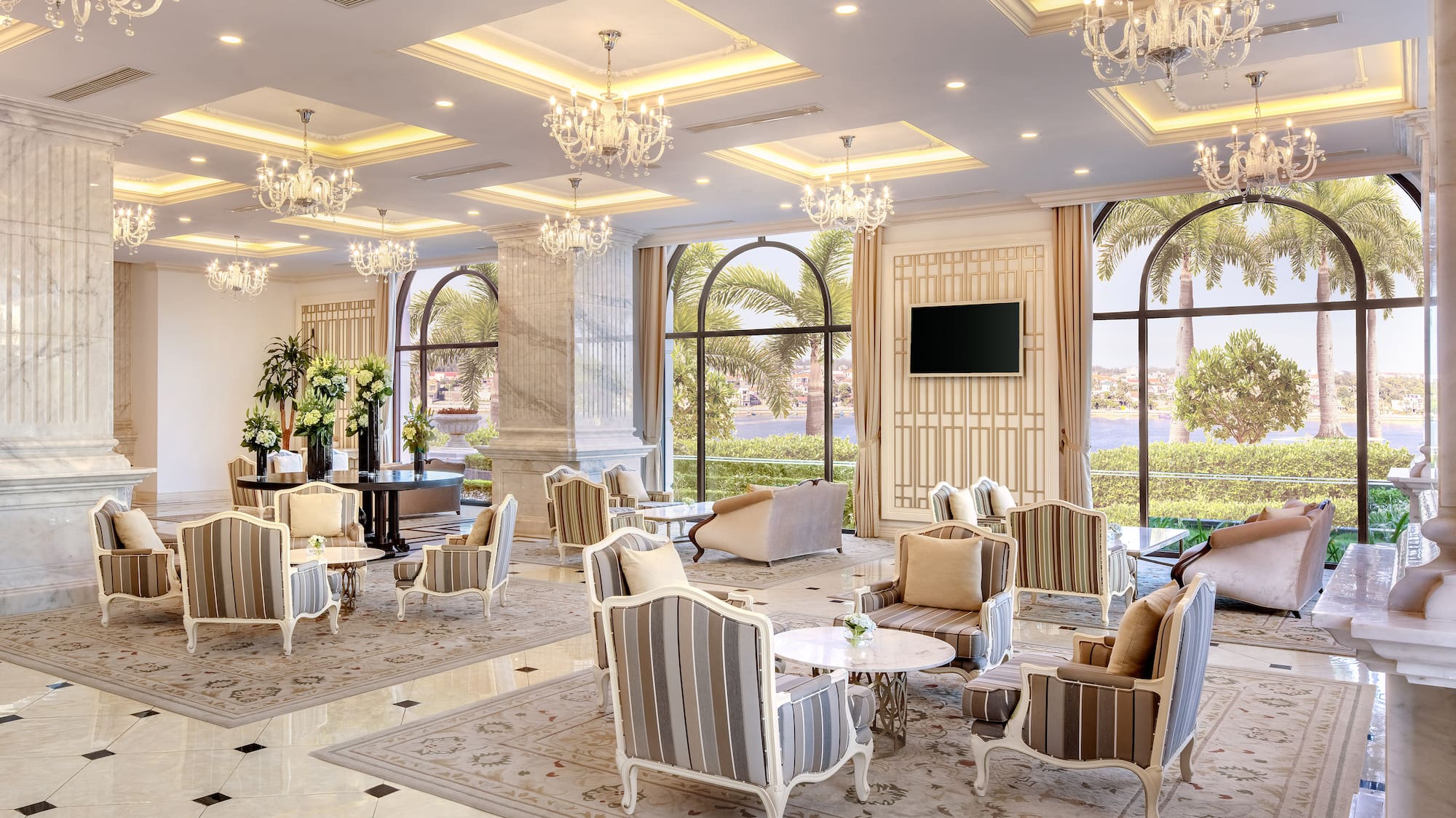 a room with chandeliers and chairs