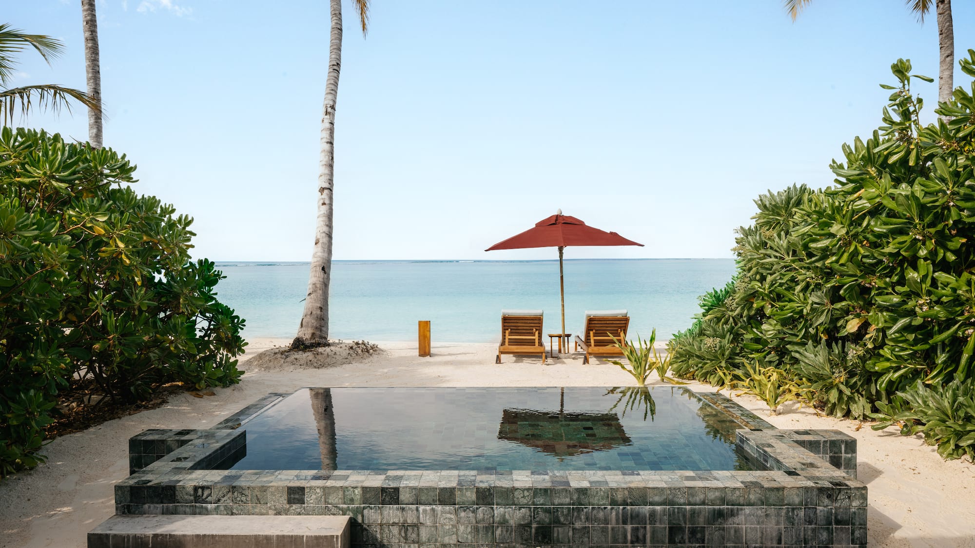 a patio with a chair and a table