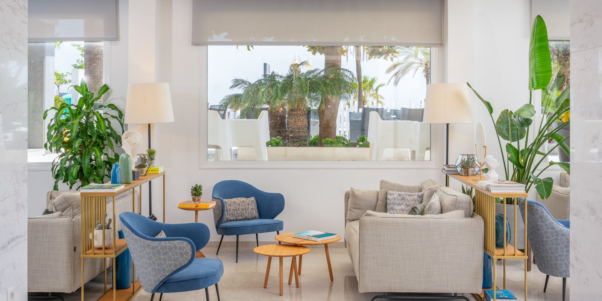 a room with a couch and chairs