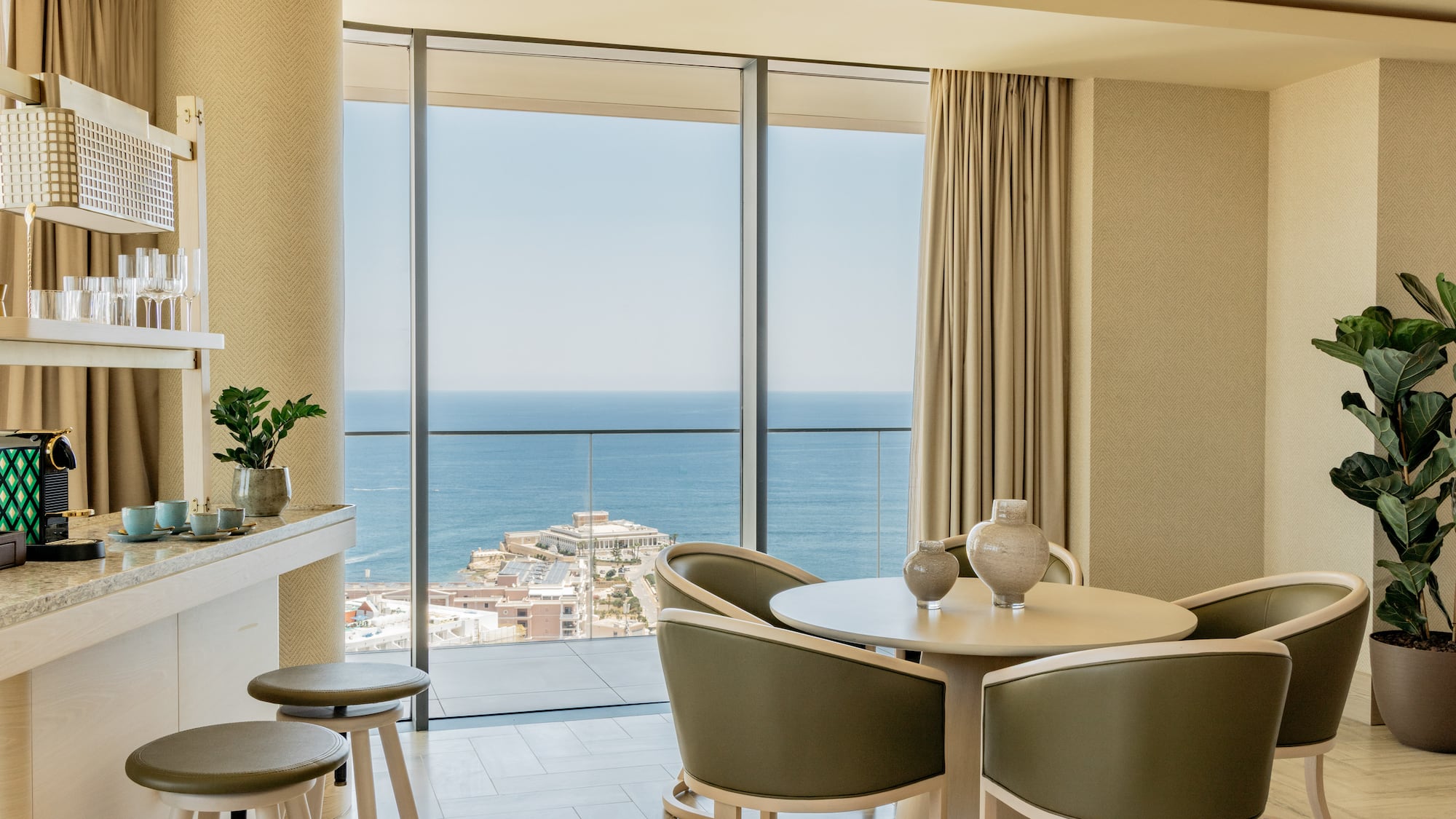 a room with a view of the ocean and a city