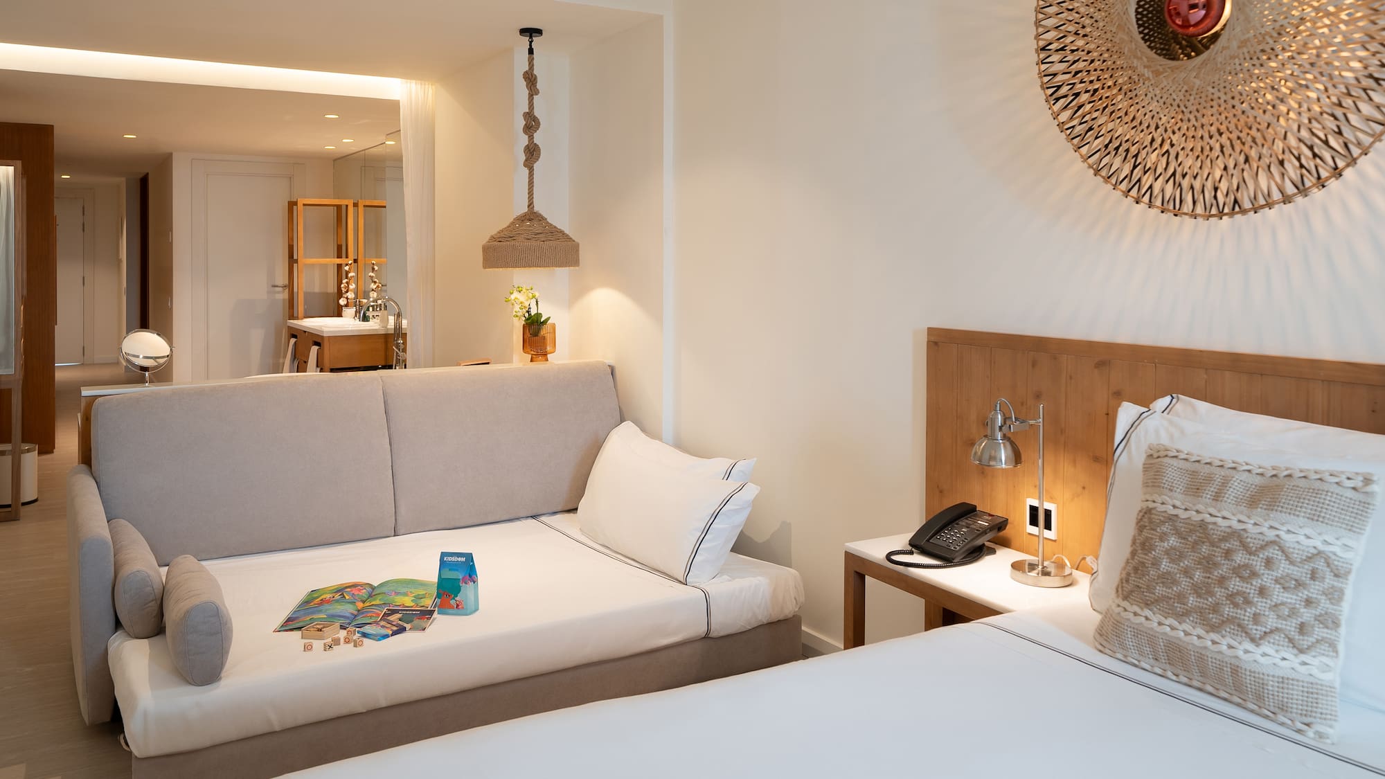 a room with two beds and a mirror