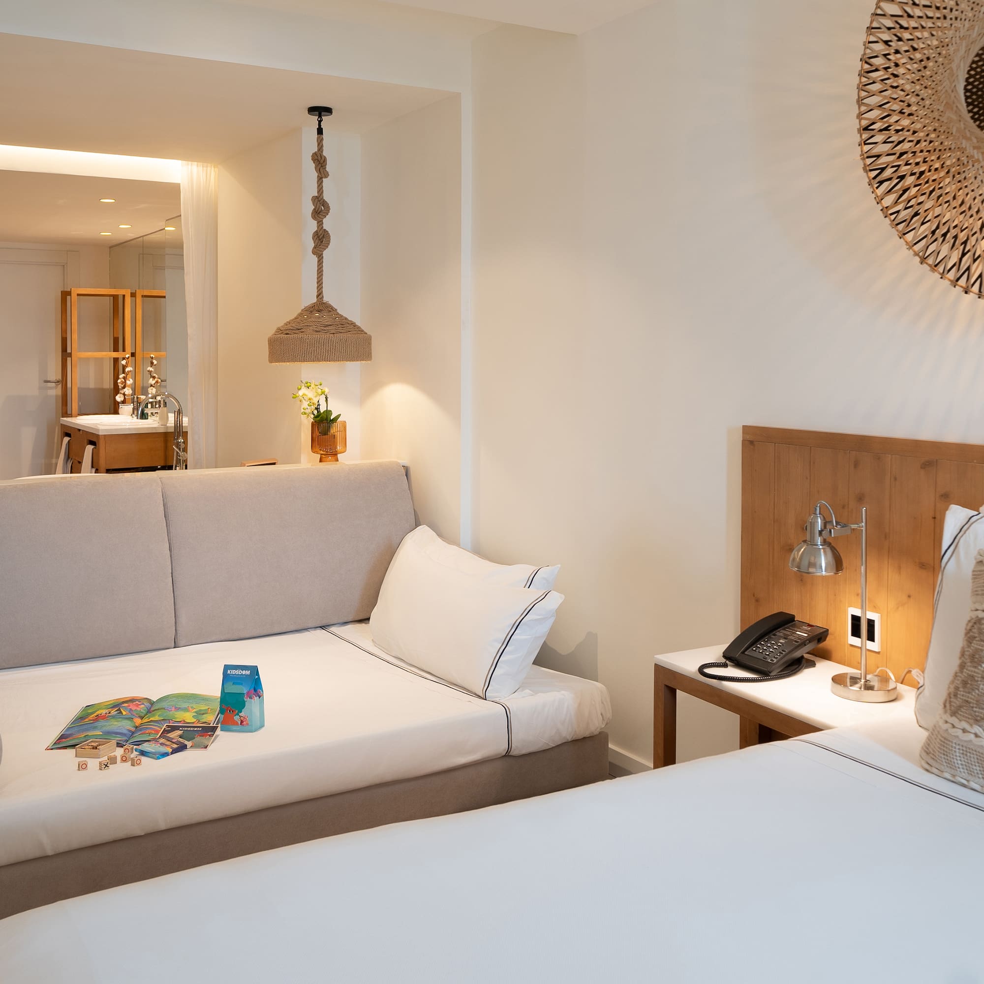 a room with two beds and a mirror