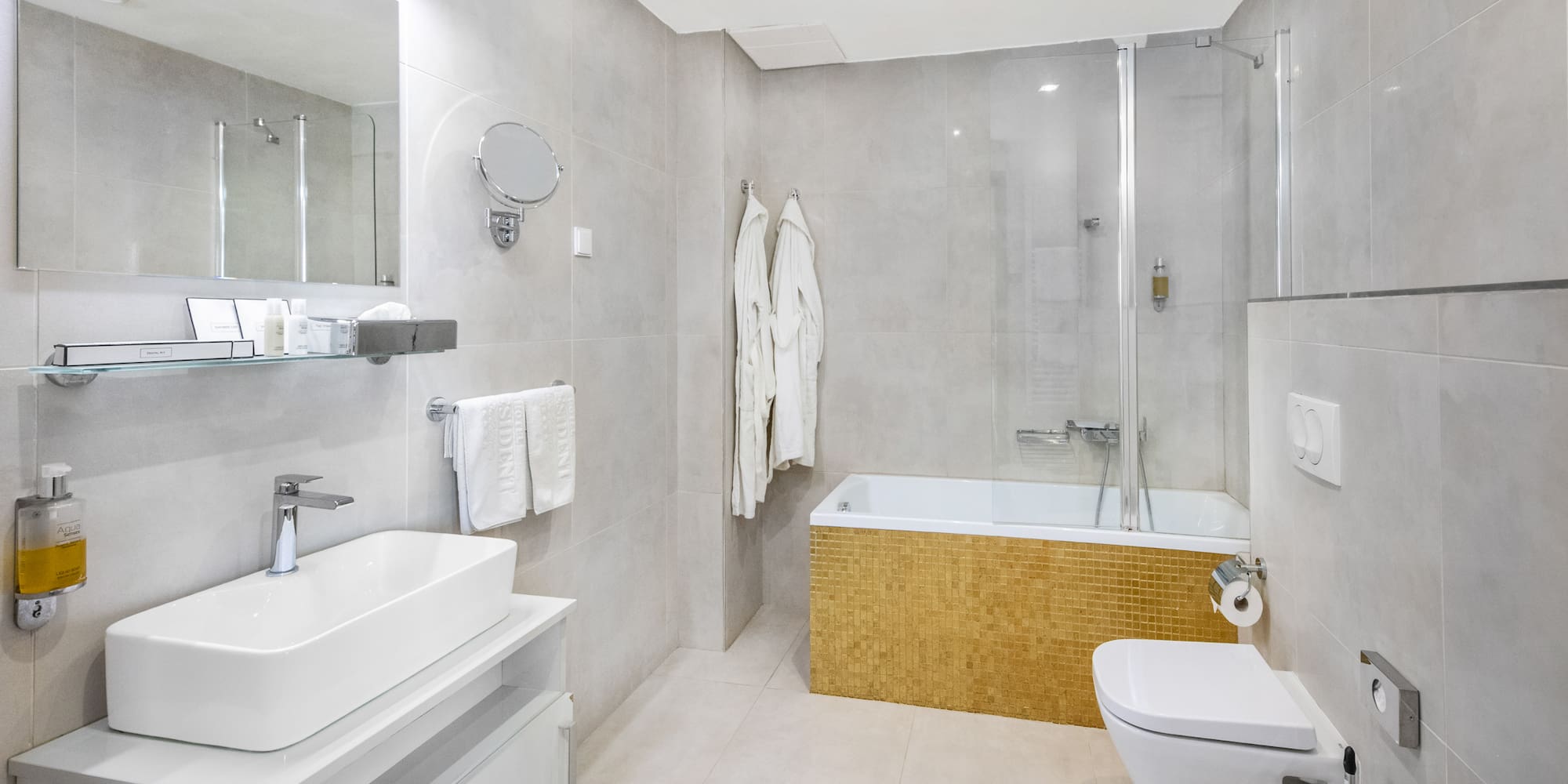 a bathroom with a tub toilet and sink