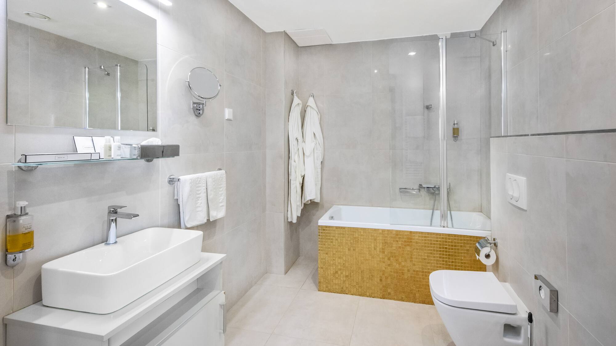 a bathroom with a tub toilet and sink