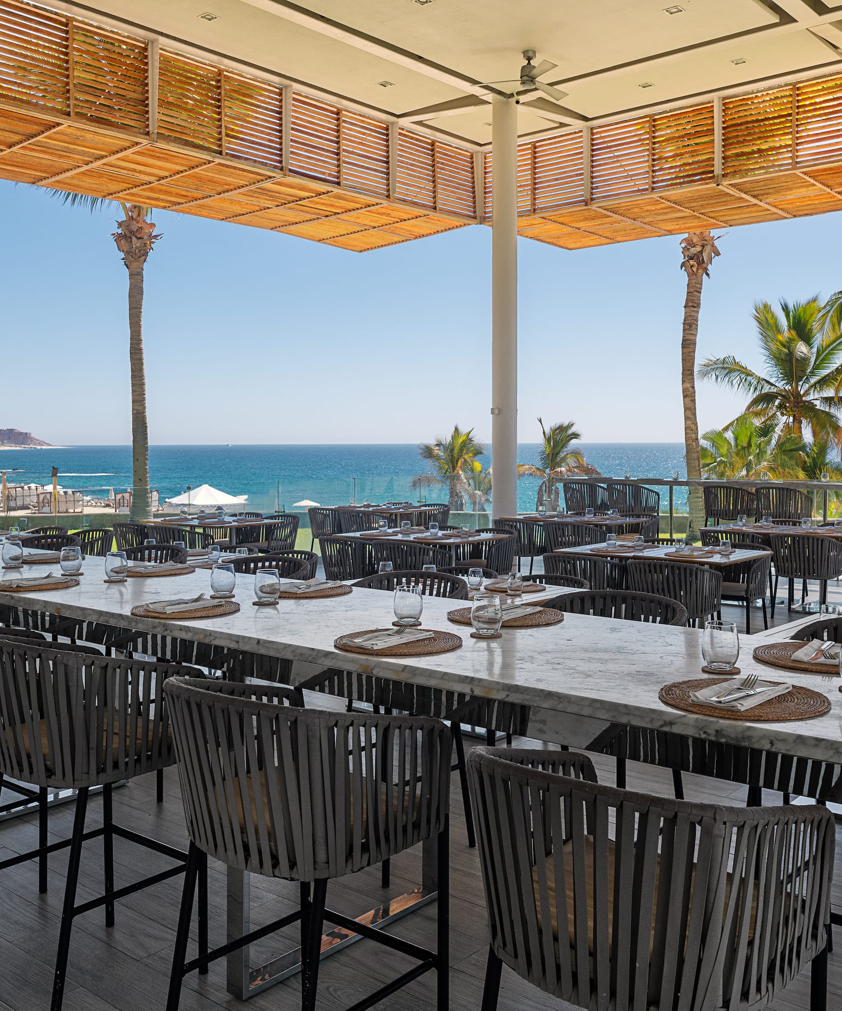 a large outdoor restaurant with tables and chairs