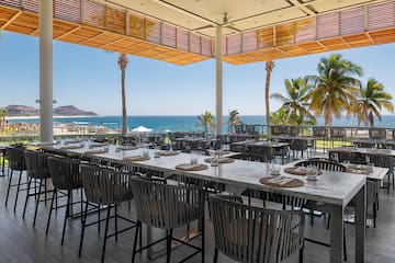a large outdoor restaurant with tables and chairs