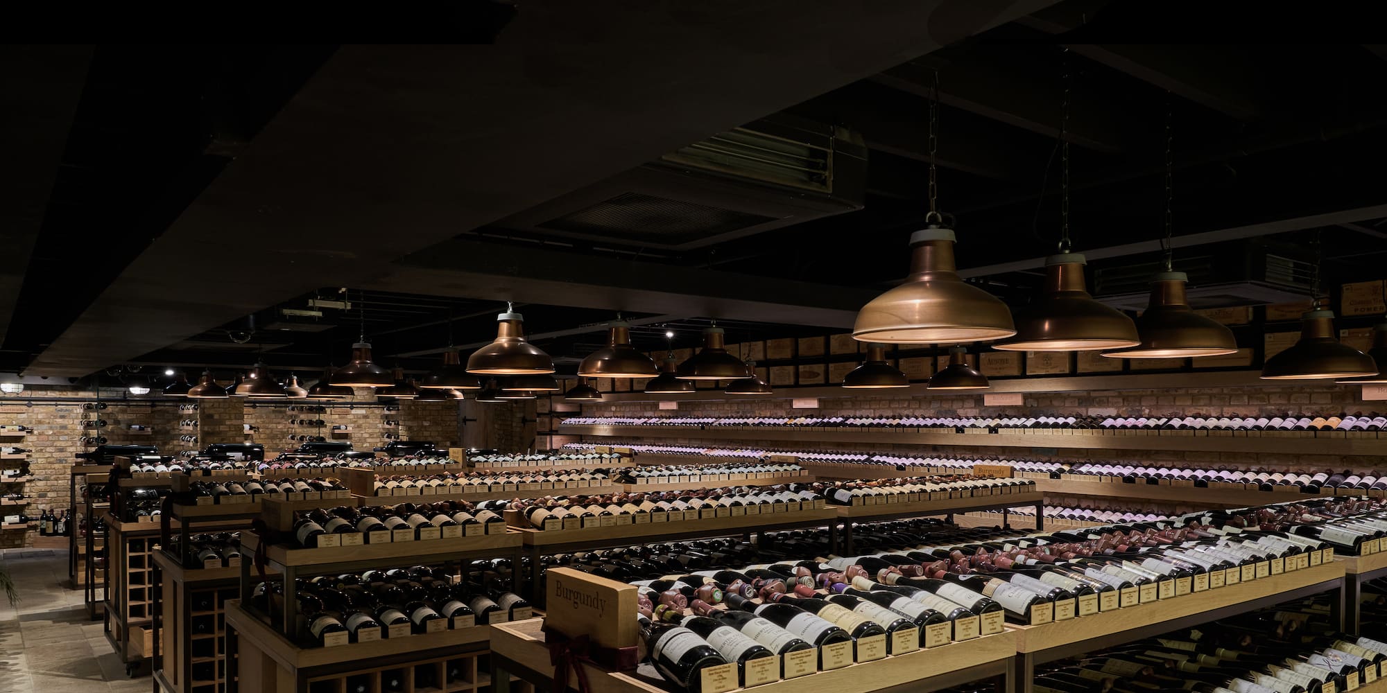 a room with shelves of wine