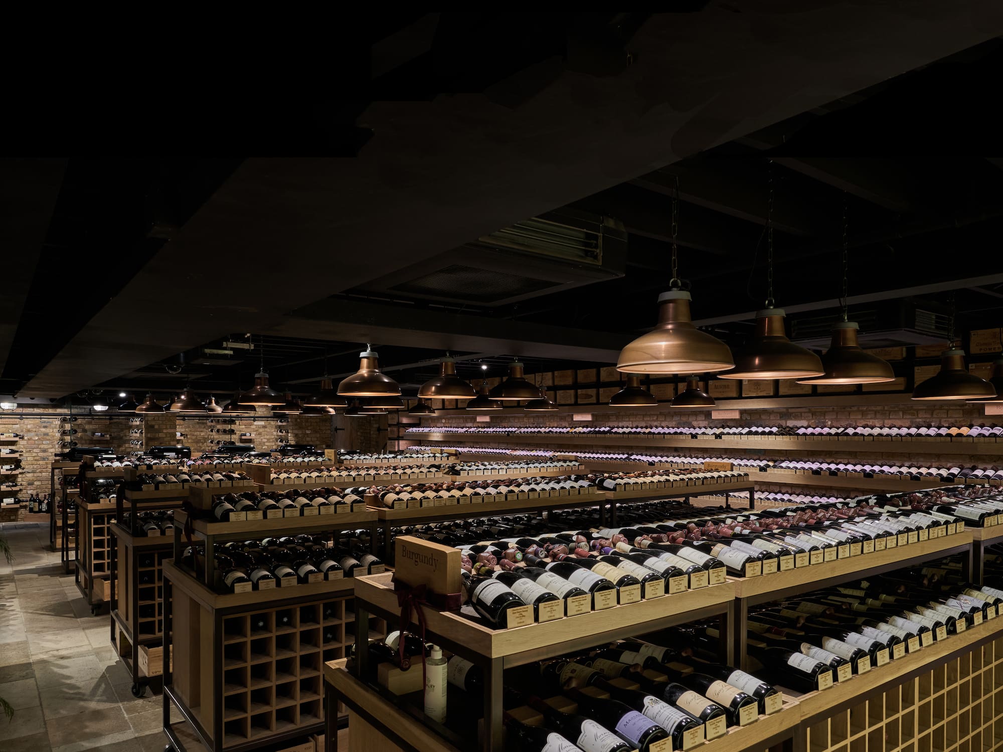 a room with shelves of wine