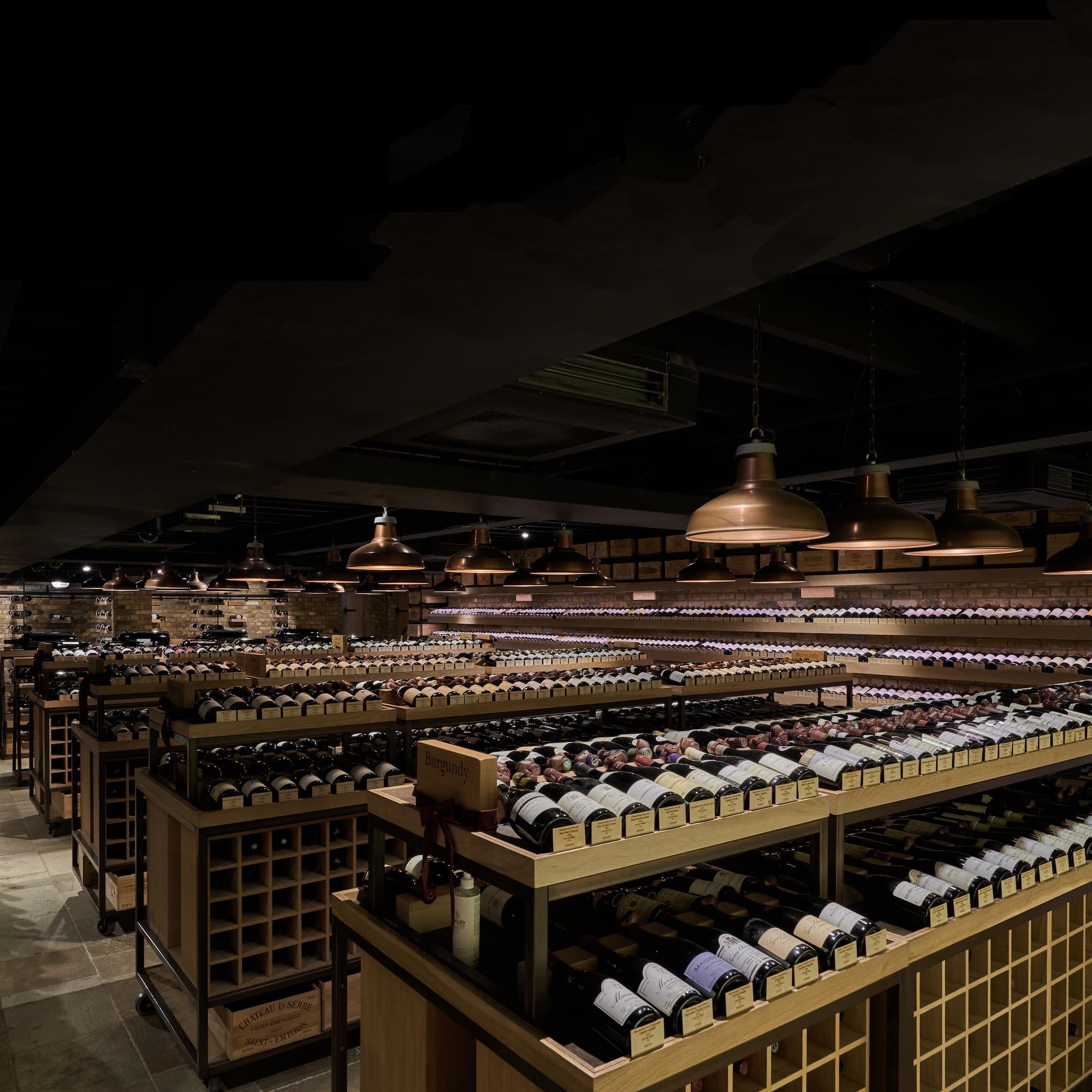 a room with shelves of wine