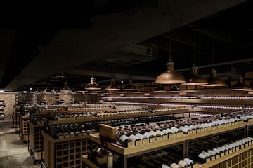 a room with shelves of wine