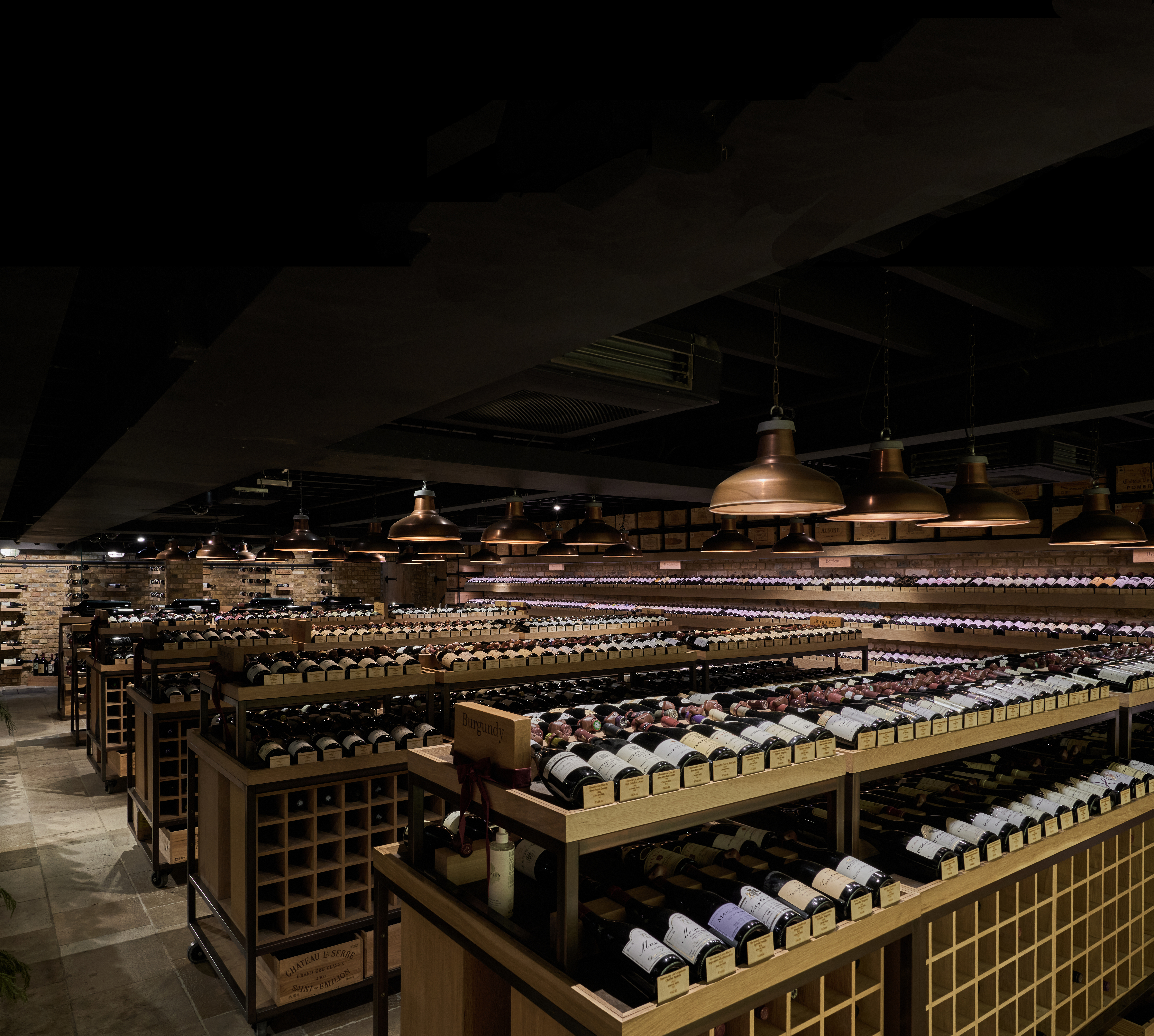 a room with shelves of wine