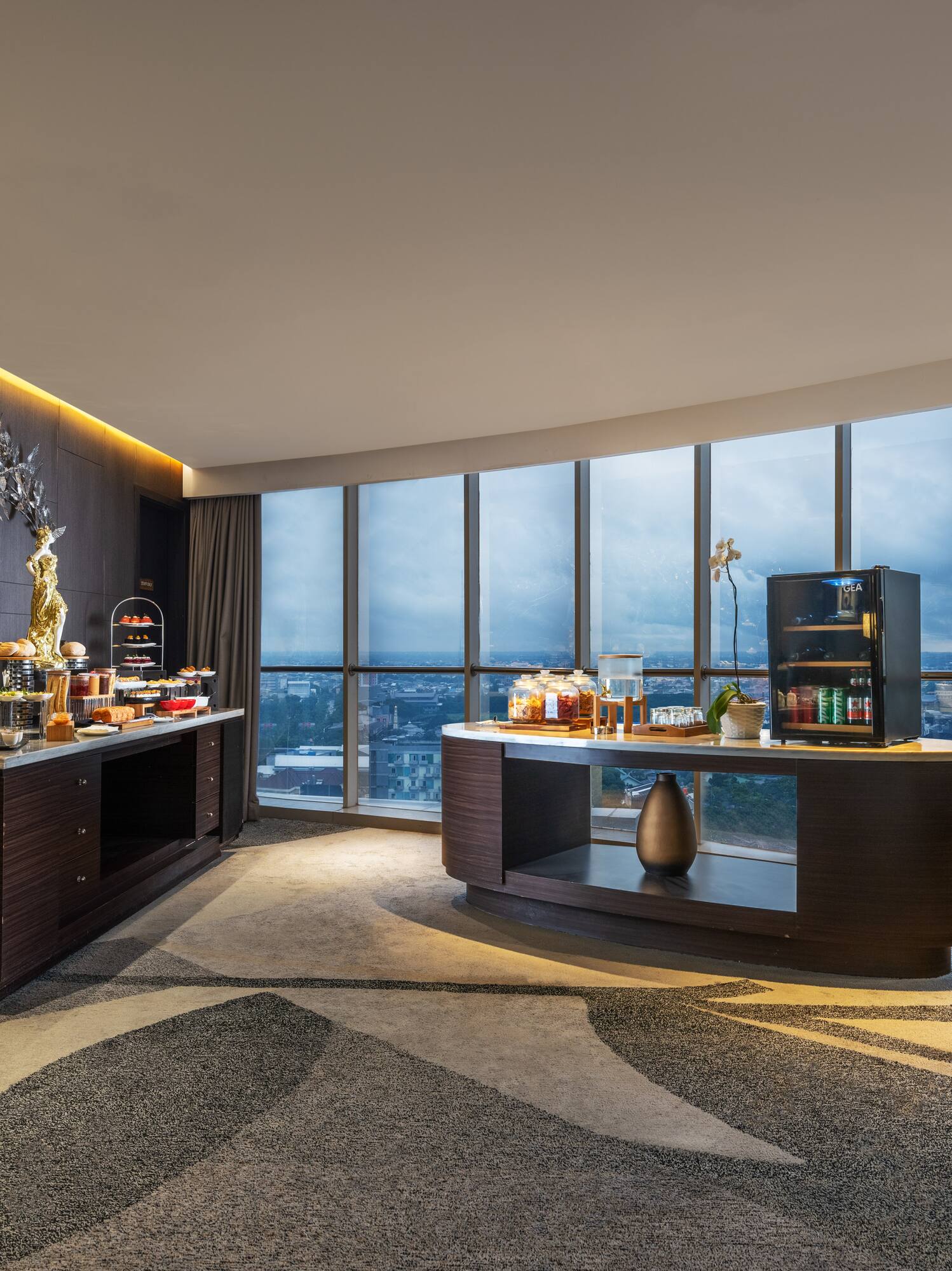 a room with a large window and a view of a city