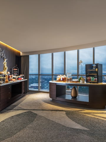 a room with a large window and a view of a city