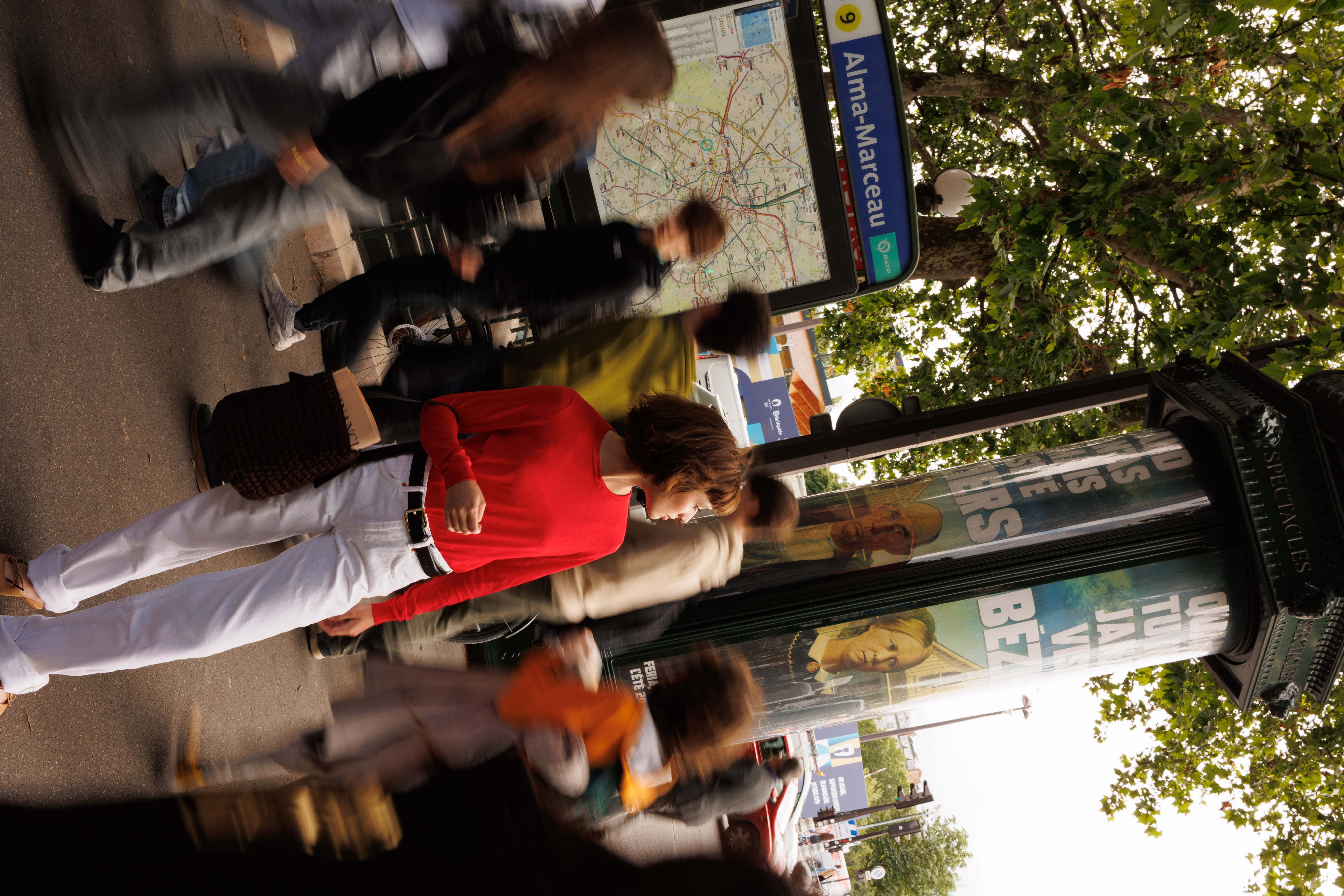 a woman walking on a sidewalk