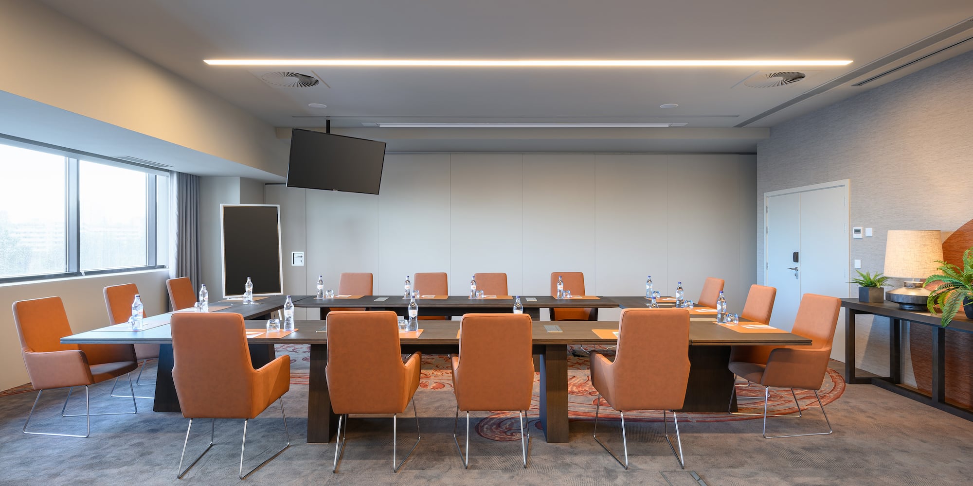 a conference room with a table and chairs